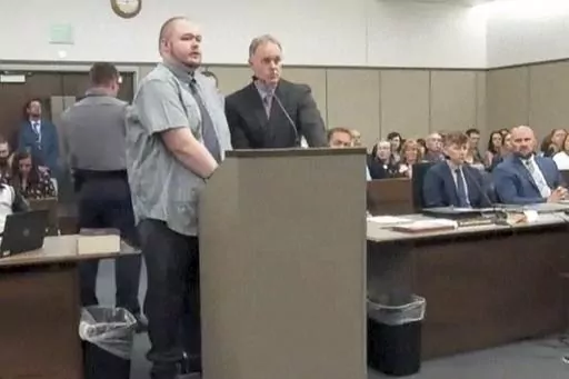 In this image taken from video provided by the Colorado Judicial Branch, Anderson Lee Aldrich, left, the suspect in a mass shooting that killed five people at a Colorado Springs LGBTQ+ nightclub in 2022, appears in court, June 26, 2023, in Colorado Springs, Colo., where they pleaded guilty in the attack. Aldrich was charged with federal hate crimes on Tuesday, Jan. 16, 2024. (Colorado Judicial Branch via AP, File)