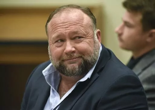 Infowars founder Alex Jones appears in court to testify during the Sandy Hook defamation damages trial at Connecticut Superior Court in Waterbury, Conn., on Sept. 22, 2022. Lawyers for several Sandy Hook families are criticizing Alex Jones' personal spending as they seek nearly $1.5 billion they won in lawsuits against the Infowars host, for his calling the 2012 Newtown school shooting that killed 26 a hoax. (Tyler Sizemore/Hearst Connecticut Media via AP, Pool, File)