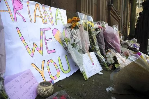 Flower tributes at St Ann's square, Manchester, England, on May 23, 2017, after a suicide bombing attack at an Ariana Grande concert at the Manchester Arena. Britain's domestic intelligence agency didn't act swiftly enough on key information and missed a significant opportunity to prevent the suicide bombing that killed 22 people at a 2017 Ariana Grande concert, an inquiry found Thursday, March 2, 2023. (AP Photo/Rui Vieira, File)