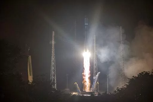 This photo provided by the CNES shows a Russian Soyuz rocket lifting off from the Kourou space base, French Guiana, early Wednesday Dec.18, 2019. The war in Ukraine is causing a swift and broad decaying of scientific ties between Russia and the West. (JM Guillon/ESA-CNES-Arianespace via AP, File)