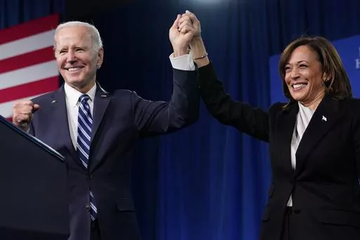 President Joe Biden and Vice President Kamala Harris stand on stage at the Democratic National Committee winter meeting, Feb. 3, 2023, in Philadelphia. Harris is poised to play a critical role in next year's election as President Joe Biden seeks a second term. (AP Photo/Patrick Semansky, File)