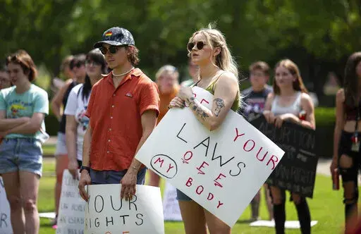 Community members gather to protest the U.S. Supreme Court's overturning of Roe v. Wade and Kentucky's trigger law to ban abortion, at Circus Square Park in Bowling Green, Ky., on Saturday, June 25, 2022.  (Grace Ramey/Daily News via AP, File)