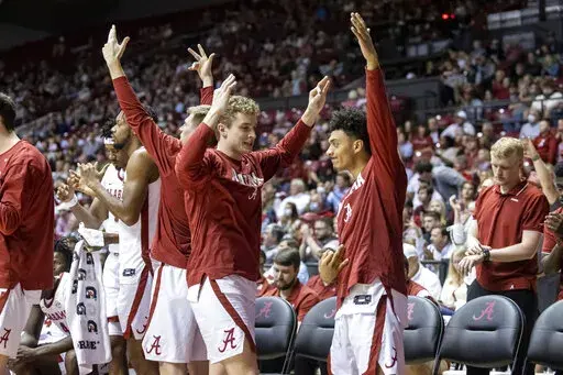 Alabama's bench celebrates a 3-point shot during the second half of the team's NCAA college basketball game against Mississippi State, Wednesday, Feb. 16, 2022, in Tuscaloosa, Ala. (AP Photo/Vasha Hunt)