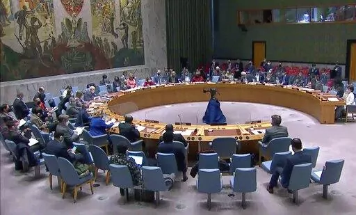 The United Nations Security Council listens to comments during a meeting, Friday, March 11, 2022, at UN headquarters. The Russian request for the Security Council meeting followed a U.S. rejection of Russian accusations that Ukraine is operating chemical and biological labs with U.S. support. (UNTV via AP)