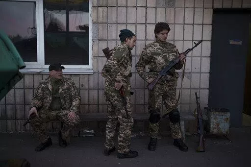 Civilian volunteers attend a training camp of the Ukrainian Territorial Defense Forces in Brovary, northeast of Kyiv, Ukraine, Monday, March 21, 2022. (AP Photo/Felipe Dana)