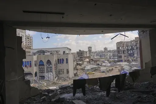 A view of the Islamic University in Gaza City, partially damaged by an Israeli bombardment and now serving as a shelter for displaced Palestinians amid the ongoing conflict in Gaza, Saturday, April 5, 2025. (AP Photo/Jehad Alshrafi)
