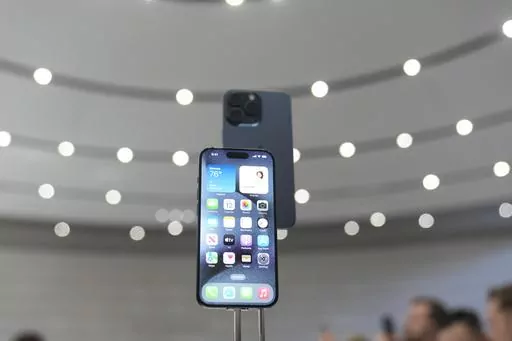 The iPhone 15 Pro is displayed during an announcement of new products on the Apple campus, Tuesday, Sept. 12, 2023, in Cupertino, Calif. (AP Photo/Jeff Chiu)
