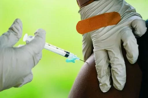 A health worker administers a dose of COVID-19 vaccine during a vaccination clinic on Sept. 14, 2021 in Reading, Pa. On Friday, Dec. 16, 2022, The Associated Press reported on stories circulating online incorrectly claiming the Centers for Disease Control and Prevention quietly confirmed that at least 118,000 children and young adults have “died suddenly” in the U.S. since the COVID-19 vaccines rolled out. (AP Photo/Matt Rourke, File)