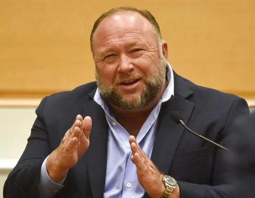 Infowars founder Alex Jones takes the witness stand to testify at the Sandy Hook defamation damages trial at Connecticut Superior Court in Waterbury, Conn. Thursday, Sept. 22, 2022. A Connecticut jury’s ruling that Jones pay $965 to people he targeted with Sandy Hook lies is heartening to people disgusted by the muck of disinformation. Just don’t expect conspiracy theories to go away.  (Tyler Sizemore/Hearst Connecticut Media via AP, Pool, File)