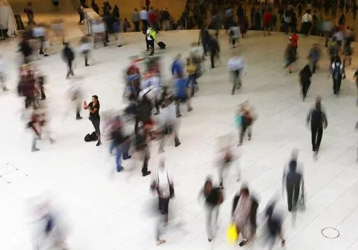 In this June 15, 2017 photo, people walk inside the Oculus in New York. Google has agreed to a $391.5 million settlement with 40 states in connection with an investigation into how the company tracked users’ locations. State attorneys general announced the settlement Monday, Nov. 14, 2022 calling it the largest multistate privacy settlement in U.S history. (AP Photo/Frank Franklin II, File)