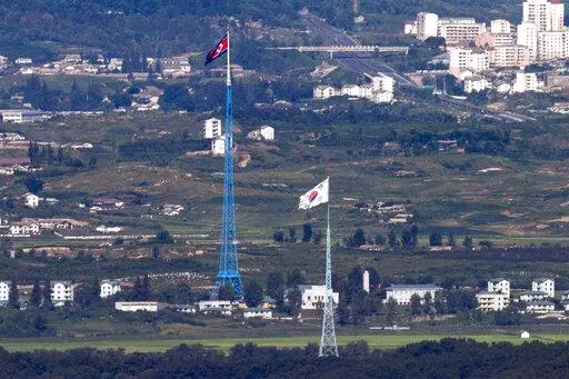 Flags of North Korea, rear, and South Korea, front, flutter in the wind as pictured from the border area between two Koreas in Paju, South Korea, on Aug. 9, 2021. South Korea’s Joint Chiefs of Staff said North Korea fired a ballistic missile toward its eastern waters Friday, Dec. 23, 2022. (Im Byung-shik/Yonhap via AP, File)