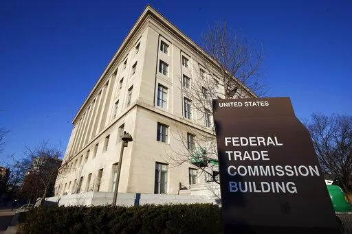 The Federal Trade Commission building in Washington is pictured on Jan. 28, 2015. The Federal Trade Commission is proposing a new rule that would prevent employers from imposing noncompete clauses on their workers. (AP Photo/Alex Brandon, File)