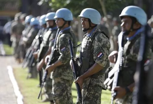 Soldiers line up at the United Nations Peace Operations Training Center (CECOPAZ) before the arrival of United Nations Secretary-General Ban Ki-Moon in Asuncion, Paraguay, on Feb. 26, 2015. The organization is marking the 75th anniversary of U.N. peacekeeping and observing the International Day of United Nations Peacekeepers on Thursday, May 25, 2023. (AP Photo/Jorge Saenz, File)
