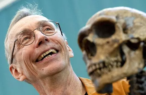 Swedish scientist Svante Paabo stands by a replica of a Neanderthal skeleton at the Max Planck Institute for Evolutionary Anthropology in Leipzig, Germany, Monday, Oct. 3, 2022. Swedish scientist Svante Paabo was awarded the 2022 Nobel Prize in Physiology or Medicine for his discoveries on human evolution. (Hendrik Schmidt/dpa via AP)