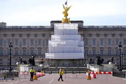 Building work in preparation for the Platinum Jubilee celebrations take place in front of Buckingham Palace in London, Friday, May 6, 2022. Britain's Queen Elizabeth II acceded to the throne on the death of her father King George VI on Feb. 6, 1952, and the Platinum Jubilee bank holiday weekend celebrations will take place on June 2-5. (AP Photo/Kirsty Wigglesworth)
