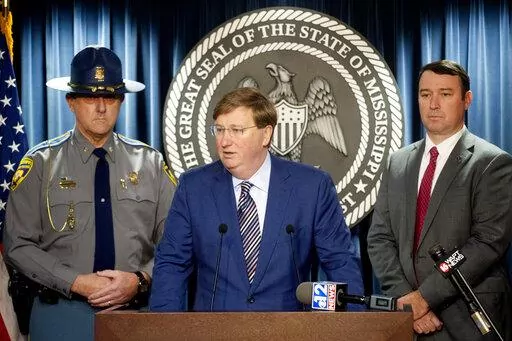 Mississippi Gov. Tate Reeves, center, expresses his gratitude for law enforcement during COVID-19, at a news conference at the Walter Sillers Building in Jackson, Miss., on Monday, Dec. 20, 2021. (Eric Shelton/The Clarion-Ledger via AP)