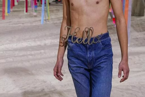 A model wears a creation for the Loewe fall-winter 22/23 men's collection, in Paris, Saturday, Jan. 22, 2022. (AP Photo/Francois Mori)