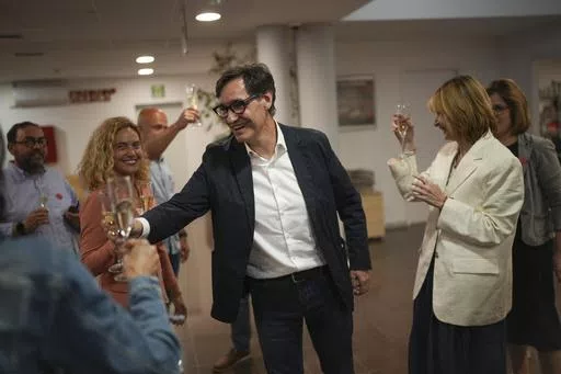 Socialist candidate Salvador Illa makes a toast with members of his team and party colleagues after the announcement of the results of elections to the Catalan parliament in Barcelona, Sunday May 12, 2024. The Socialists led by former health minister Illa won a majority of 42 seats, up from their 33 seats in 2021 when they also barely won the most votes but were unable to form a government. They will still need to earn the backing of other parties to put Illa in charge.(AP Photo/Emilio Morenatti