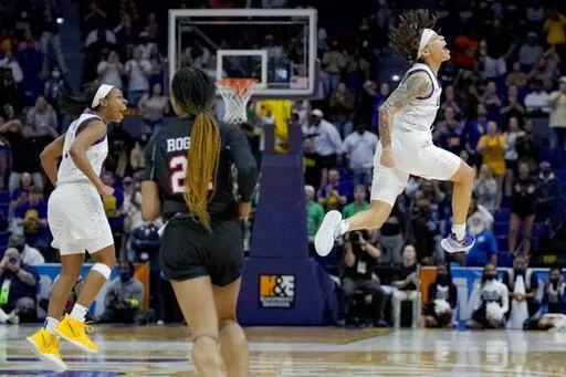 LSU guards Jailin Cherry, right, and Khayla Pointer, left, react in the second half of a women's college basketball game against Jackson State in the first round of the NCAA tournament, Saturday, March 19, 2022, in Baton Rouge, La. (AP Photo/Matthew Hinton)
