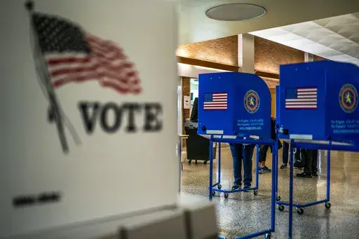 A woman marks her ballot inside of a voting center during early voting in the states' presidential primary election, March 26, 2024, in Freeport, N.Y. (AP Photo/Eduardo Munoz Alvarez, File)