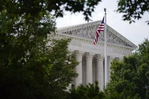 An American flag waves in front of the U.S. Supreme Court building, Monday, June 27, 2022, in Washington. (AP Photo/Patrick Semansky, File)