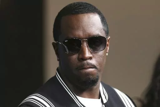 In this May 30, 2018, file photo, Sean "Diddy" Combs arrives at the LA Premiere of "The Four: Battle For Stardom" at the CBS Radford Studio Center in Los Angeles. Combs' lawyer said Tuesday, March 26, 2024, that the searches of his Los Angeles and Miami properties by federal authorities in a sex-trafficking investigation were ”a gross use of military-level force" and that Combs is “innocent and will continue to fight" to clear his name. (Photo by Willy Sanjuan/Invision/AP, File)