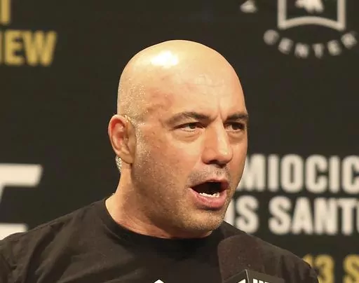 Joe Rogan is seen during a weigh-in before UFC 211 on Friday, May 12, 2017, in Dallas. Spotify has penned a new multi-year partnership deal with Rogan, Friday, Feb. 2, 2024. The enormously popular show will soon also be available on competing platforms, including YouTube and Apple Podcasts. ( AP Photo/Gregory Payan, File)