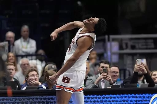 Auburn center Dylan Cardwell (44) reacts after scoring during the second half of an NCAA college basketball game against Mississippi State in the semifinal round of the Southeastern Conference tournament, Saturday, March 16, 2024, in Nashville, Tenn. (AP Photo/John Bazemore)