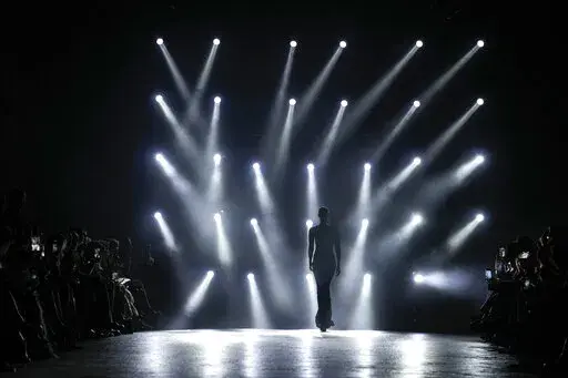 A model wears a creation as part of the Roberto Cavalli Fall/Winter 2022-2023 fashion collection, unveiled during the Fashion Week in Milan, Italy, Wednesday, Feb. 23, 2022. (AP Photo/Antonio Calanni)