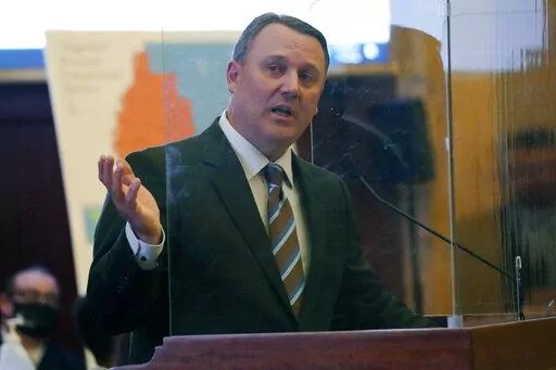 Rep. Jason White, R-West, explains a facets of a congressional redistricting bill that earlier passed the House Rules Committee, on Wednesday, during debate at the Mississippi State Capitol in Jackson, Thursday, Jan. 6, 2022. The majority of the House voted for the committee approved bill that redraws the current congressional districts. (AP Photo/Rogelio V. Solis)