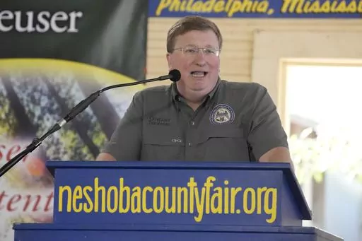 Mississippi Republican Gov. Tate Reeves addresses the crowd at the Neshoba County Fair in Philadelphia, Miss., Thursday, July 27, 2023. Reeves faces two opponents in the party primary Aug. 8, as he seeks reelection. (AP Photo/Rogelio V. Solis)