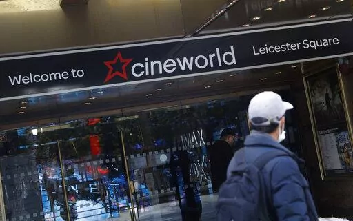 A man walks past a Cineworld cinema in Leicester Square, London, on Oct. 5, 2020. Cineworld Group PLC, the world's second-largest chain of movie theaters, said Monday Aug. 22, 2022 that it is considering filing for Chapter 11 bankruptcy protection in the U.S. and similar actions elsewhere. (AP Photo/Alastair Grant, File)