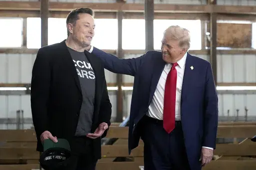 Tesla and SpaceX CEO Elon Musk, left, and Republican presidential nominee former President Donald Trump attend a campaign event at the Butler Farm Show on Oct. 5, 2024, in Butler, Pa. (AP Photo/Alex Brandon, File)