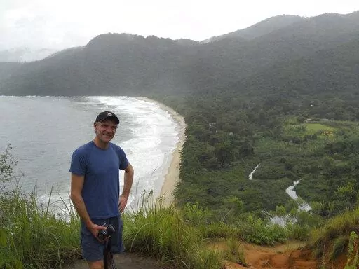 In this photo provided by Tom Hennigan, British Journalist Dom Phillips poses for a photo during a hike in Paraty, Brazil, April 2, 2010. British journalist Dom Phillips’ quest to unlock the secrets of how to preserve Brazil’s Amazon was cut short this June 2022, when he was killed along with a colleague in the heart of the forest he so cherished. (Tom Hennigan via AP)
