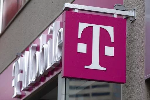 The T-Mobile logo is seen on a storefront, Oct. 14, 2022, in Boston. The U.S. wireless carrier T-Mobile said Thursday, Jan. 19, 2023, that an unidentified malicious intruder breached its network in late November and stole data on 37 million customers, including addresses, phone numbers and dates of birth. (AP Photo/Michael Dwyer, File)