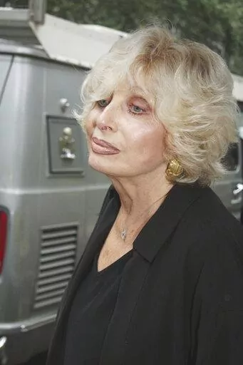 American mezzo-soprano Joanna Simon leaves St. Bartholomew's Church in New York, Thursday, July 23, 2009 after the funeral for Walter Cronkite at St. Bartholomew's Church.  Simon, an acclaimed mezzo-soprano, Emmy-winning TV correspondent and one of the three singing Simon sisters who include pop star Carly, has died at age 85.  Simon, the eldest of four, died Wednesday, Oct. 19, 2022, just a day before her sister Lucy died, according to Lucy's daughter, Julie Simon. (AP Photo/William Regan, File