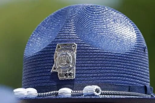 The emblem of a Mississippi Highway Patrol badge is shown on a hat worn by uniformed officers during a ceremony, June 30, 2021, in Pearl, Miss. Law enforcement authorities say a Mississippi Highway Patrol vehicle struck and killed a 27-year-old pedestrian on Saturday, May 6, 2023, in Tunica County, Miss. Mississippi Department of Public Safety spokesperson Bailey Martin said the trooper involved in the incident has been put on “modified duty.” (AP Photo/Rogelio V. Solis, File)