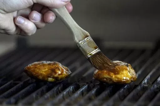 Chef Zach Tyndall prepares Good Meat's cultivated chicken at the Eat Just office in Alameda, Calif., June 14, 2023. Lab-grown meat is not currently available in any U.S. grocery stores or restaurants. If some lawmakers have their way, it never will be. (AP Photo/Jeff Chiu, File)