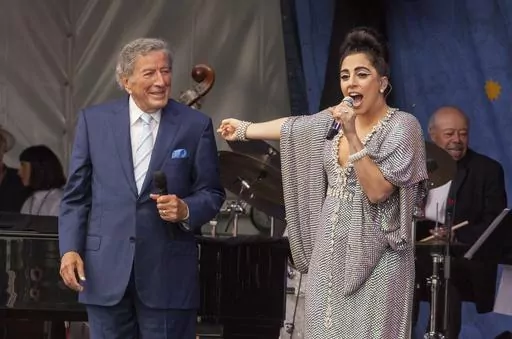 Tony Bennett, left, and Lady Gaga perform at the New Orleans Jazz & Heritage Festival, on April 26, 2015 in New Orleans. Bennett died Friday, July 21, 2023. at age 96. (Photo by Barry Brecheisen/Invision/AP, File)