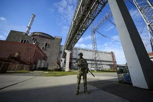 A Russian serviceman guards in an area of the Zaporizhzhia Nuclear Power Station in territory under Russian military control, southeastern Ukraine, May 1, 2022. The head of the United Nations' nuclear watchdog Rafael Grossi is expressing growing anxiety about the safety of the Zaporizhzhia Nuclear Power Plant, after the governor of the Russia-occupied area ordered the evacuation of a town where most plant staff live amid ongoing attacks in the area. (AP Photo/File)