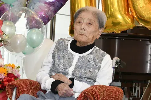This photo provided by Ashiya City shows Tomiko Itooka, being celebrated for her 116th birthday at the nursing home she lives in Ashiya, western Japan, on May 23, 2024. (Ashiya City via AP, File)