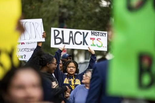 Hundreds participate in the National Action Network demonstration in response to Gov. Ron DeSantis' rejection of a high school African American history course, Wednesday, Feb. 15, 2023, in Tallahassee, Fla. In a statement, Monday, April 24, 2023, the College Board announced changes will be made to the new AP African American course framework amid criticism earlier in the year that the agency bowed to political pressure and removed several topics from the framework, including Black Lives Matter, 