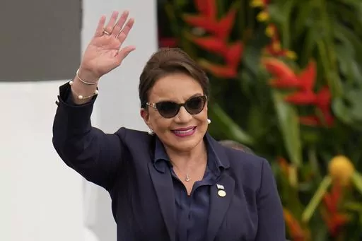 Honduras' President Xiomara Castro waves during the swearing-in ceremony for Colombia's President Gustavo Petro in Bogota, Colombia, Sunday, Aug. 7, 2022. Castro announced on Tuesday, March 14, 2023, that Honduras under her administration is opening diplomatic relations with the People´s Republic of China. (AP Photo/Fernando Vergara, File)