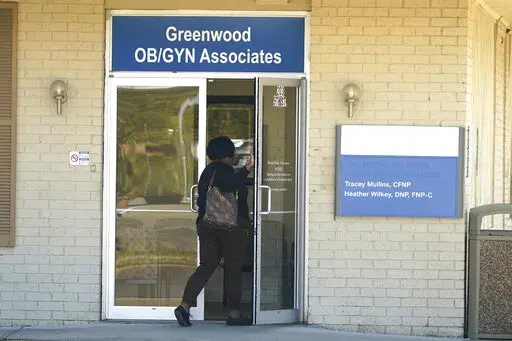 An individual enters the Greenwood OB/GYN Associates clinic across the street from the Greenwood Leflore Hospital in Greenwood, Miss., Oct. 21, 2022. (AP Photo/Rogelio V. Solis)