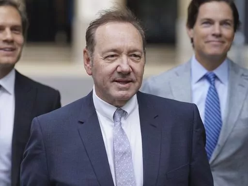 US Actor Kevin Spacey, center, arrives at Southwark Crown Court, London, Tuesday, July 4, 2023. Spacey is charged with three counts of indecent assault, seven counts of sexual assault, one count of causing a person to engage in sexual activity without consent and one count of causing a person to engage in penetrative sexual activity without consent between 2001 and 2005. (Lucy North/PA via AP)