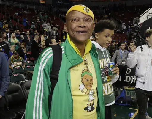 Former Seattle SuperSonics player Slick Watts stands courtside before an NBA basketball game on Friday, Oct. 5, 2018, in Seattle. (AP Photo/Ted S. Warren,File)