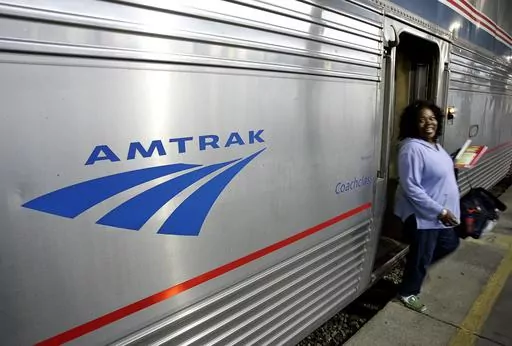 A passenger disembarks from Amtrak's Sunset Limited at its final stop in New Orleans, Nov. 2, 2008. The Biden administration announced Monday, Sept. 25, 2023, that it has awarded more than $1.4 billion to projects that improve railway safety and boost capacity, with much of the money coming from the 2021 infrastructure law. (AP Photo/Pat Semansky, File)