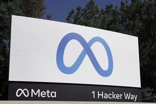 Facebook's Meta logo sign is seen at the company headquarters in Menlo Park, Calif., Oct. 28, 2021. European Union hits Facebook parent Meta with record $1.3 billion fine over transfers of user data to US. (AP Photo/Tony Avelar, File)