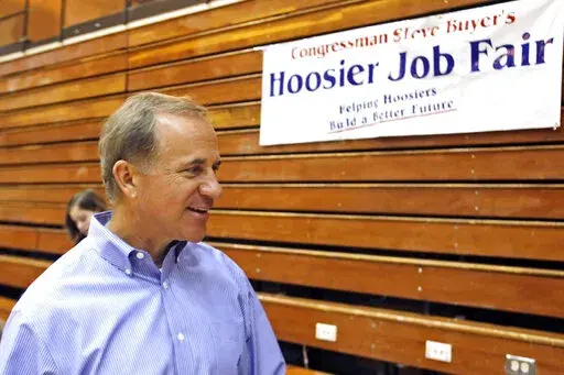 FILE — Indiana Congressman Stephen Buyer talks during a Hoosier Job Fair, July 19, 2010, at Jefferson High School in Lafayette, Ind. The former U.S. congressman from Indiana, technology company executives and an investment banker are among nine people charged in four separate and unrelated insider trading schemes. The charges were announced Monday, July 25, 2022 in Manhattan. (Michael Heinz/Journal & Courier via AP)