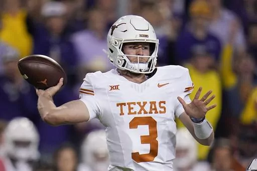 Texas quarterback Quinn Ewers throws a pass against TCU during the first half of an NCAA college football game, Saturday, Nov. 11, 2023, in Fort Worth, Texas. Ewers, the Texas native in his second season with the Longhorns after a year at Ohio State, is averaging 271 yards passing per game with 17 TDs and and five interceptions in his 10 games. (AP Photo/Julio Cortez, File)